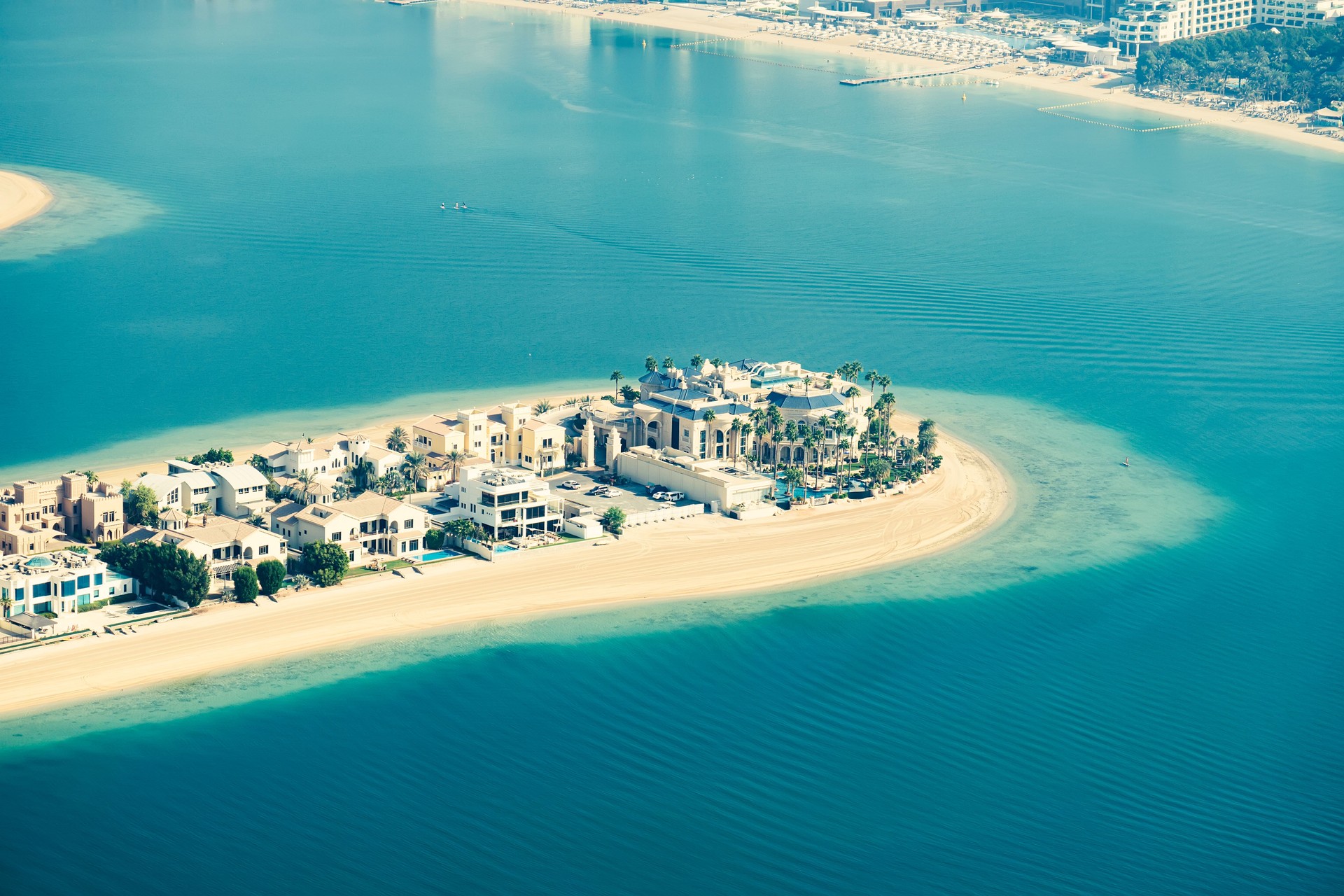 Close up view of luxury homes and villas on the palm jumeirah islands , vacation destination homes real estate in Dubai